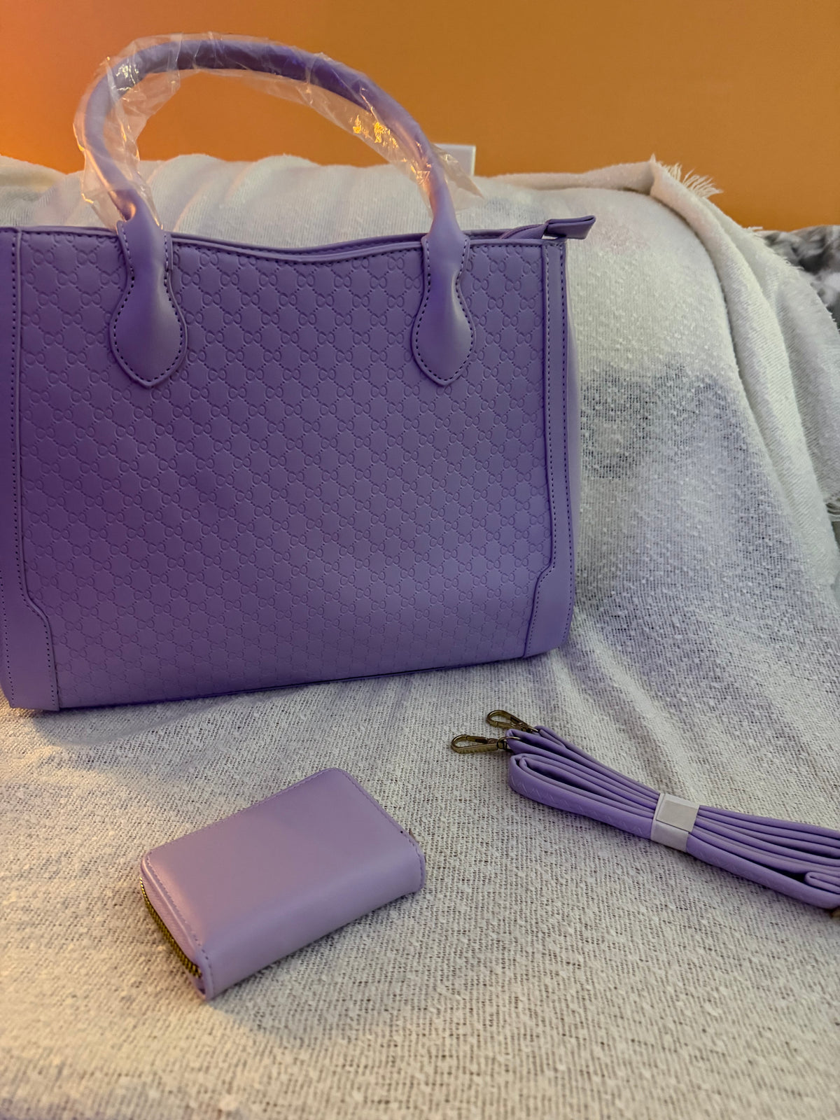 Lavender purple embossed tote bag with matching wallet and crossbody strap