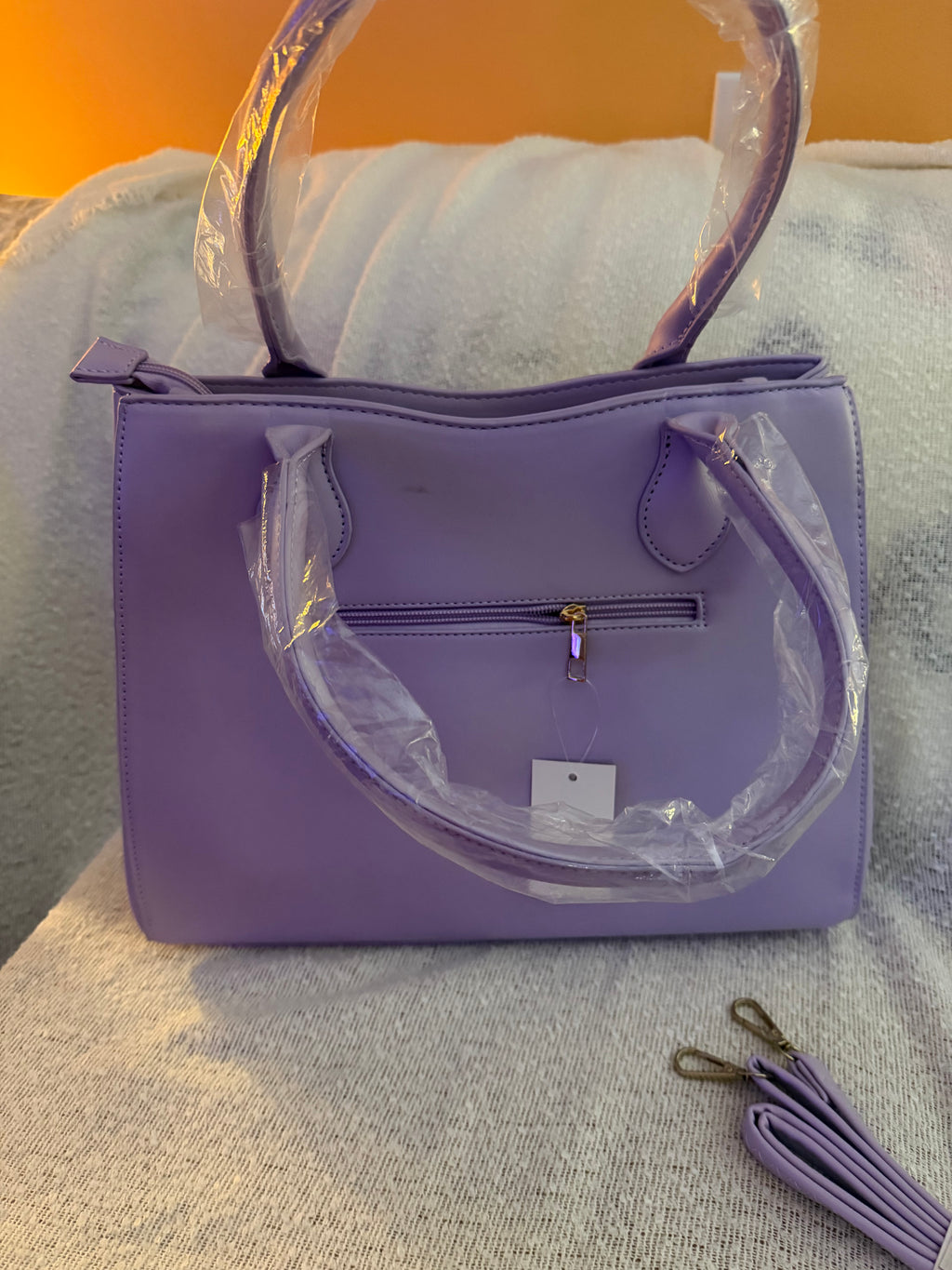 Back view of lavender purple tote bag showing exterior zip pocket